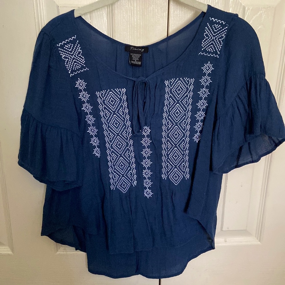White embroidered navy blouse